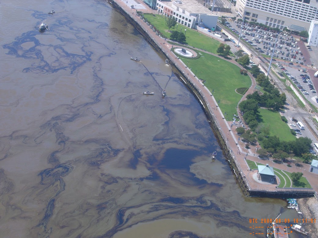 On  July 23, 2008,  the chemical tanker Tintomara collided with fuel barge DM932 on the Mississippi River, near New Orleans, Louisiana. Shown here is an aerial view of the resulting oil spill.