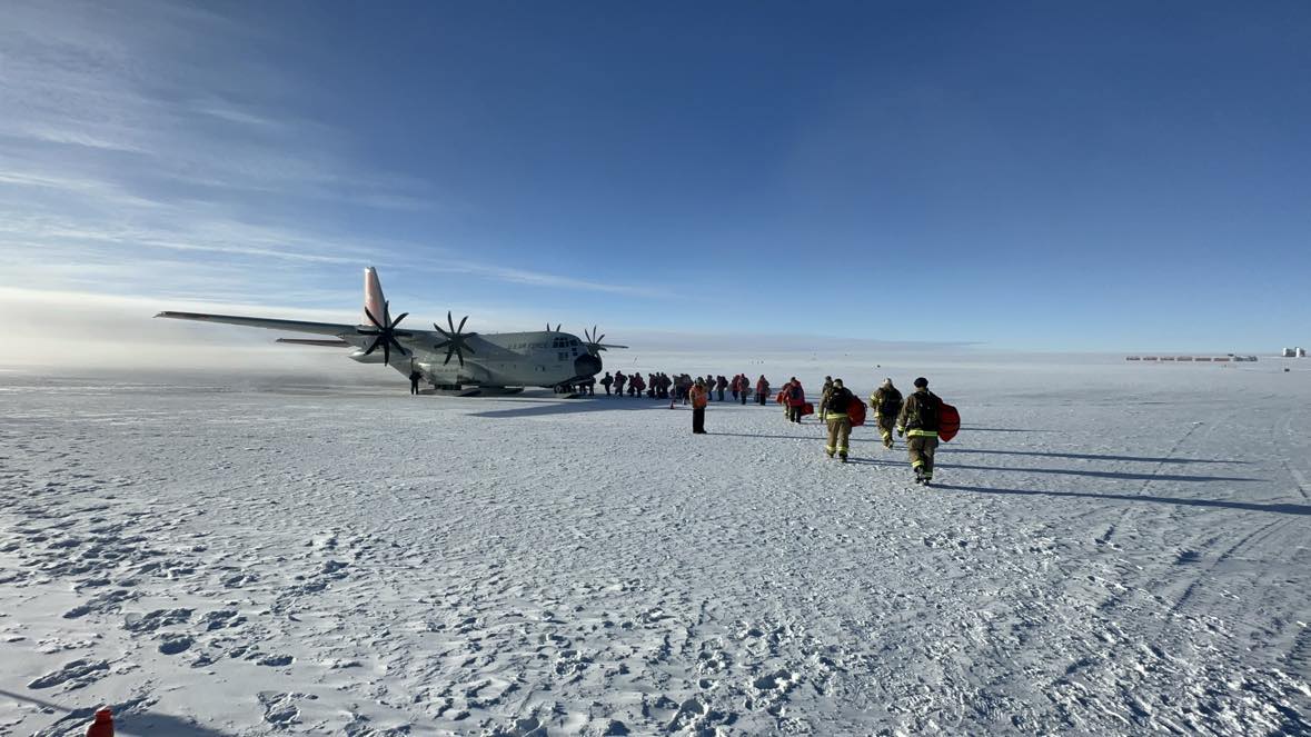 Amundsen Scott Station staff board an Air National Guard C-130 for the last scheduled flight out of the South Pole.