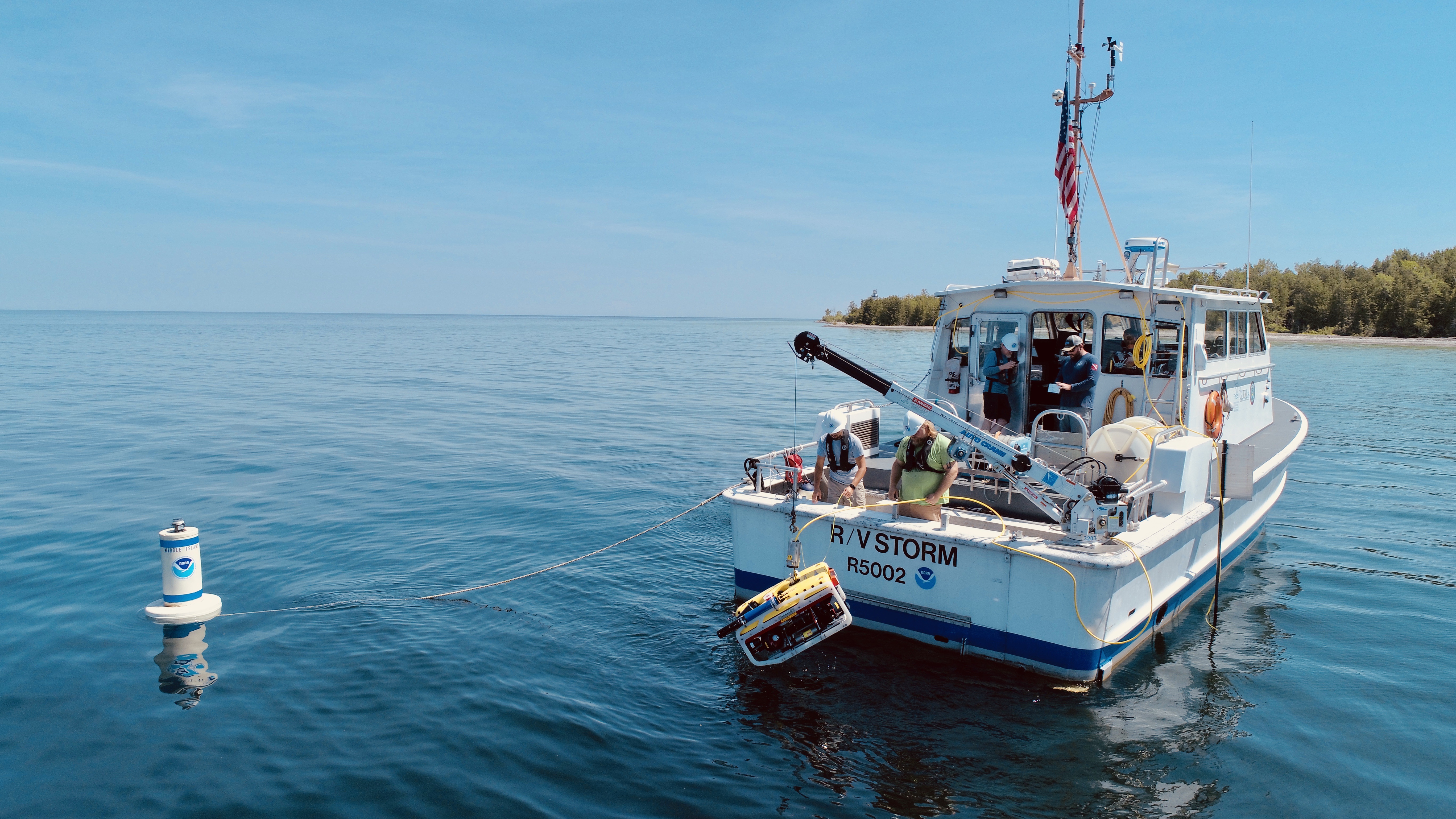 Researchers deploy a remotely operated vehicle to install flow meters at the Middle Island Sinkhole in Lake Huron, July 17, 2019. The flow meters will help researchers determine how much groundwater the sinkhole is contributing to the lake.