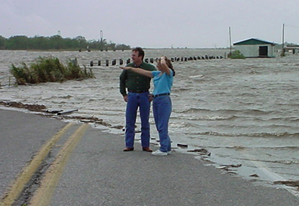 Storm surge on a Louisiana highway shows the effects of rising sea levels.