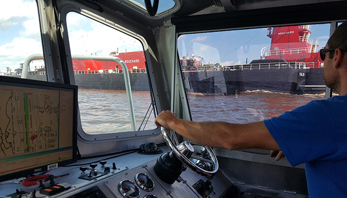 James Kirkpatrick, team lead of NOAA’s Navigation Response Team (NRT) surveys the Cape Fear River following Hurricane Florence on September 18, 2018. 