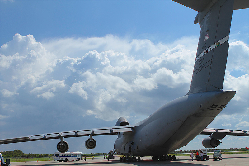 NOAA’s GOES-R satellite arrives in Florida on a massive U.S. Air Force C-5 aircraft. The aircraft touched down on the same three-mile long runway previously used by NASA’s Space Shuttle. Members of the GOES-R team wait anxiously on the tarmac.