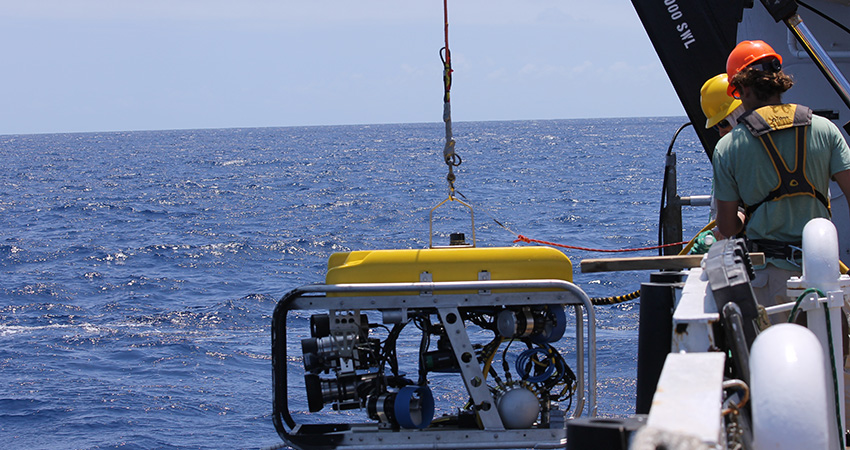 Technicians deploy the ROV off the side of NOAA Ship Nancy Foster into the blue waters of the US Virgin Islands. 