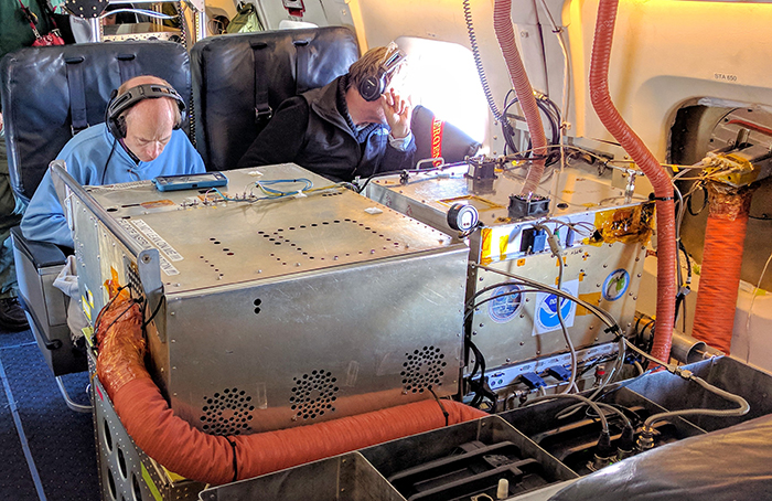 The inside of NASA' DC-8, the world’s largest flying chemistry lab, is crammed with instruments operated by scientists from NOAA and other research institutions.