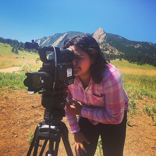 A student looks through a video camera in Chautauqua Park in Boulder, Colorado. The Lens on Climate Change project at the Cooperative Institute for Research in Environmental Sciences engages Colorado middle and high school students in film production that documents the effects of climate and environmental changes on their lives and in their communities.