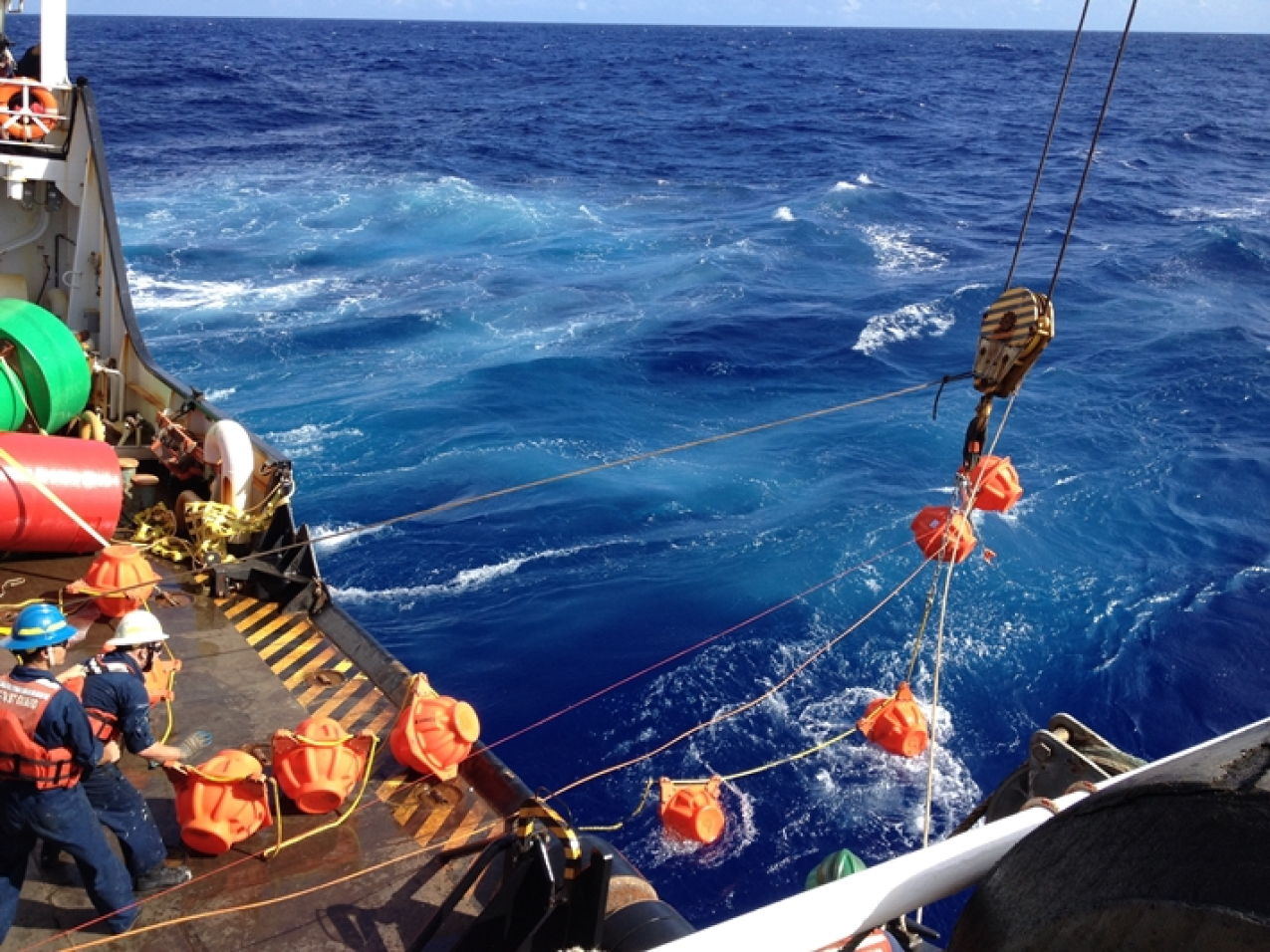 Hauling up hydrophone during the Challenger Deep mission in 2015.
