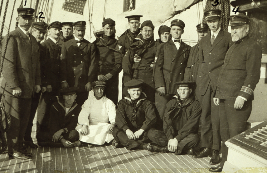 A black and white photo of the officers and crew of USC&GS Ship Matchless. The ship's name is visible on the cap ribbons of some of the men.