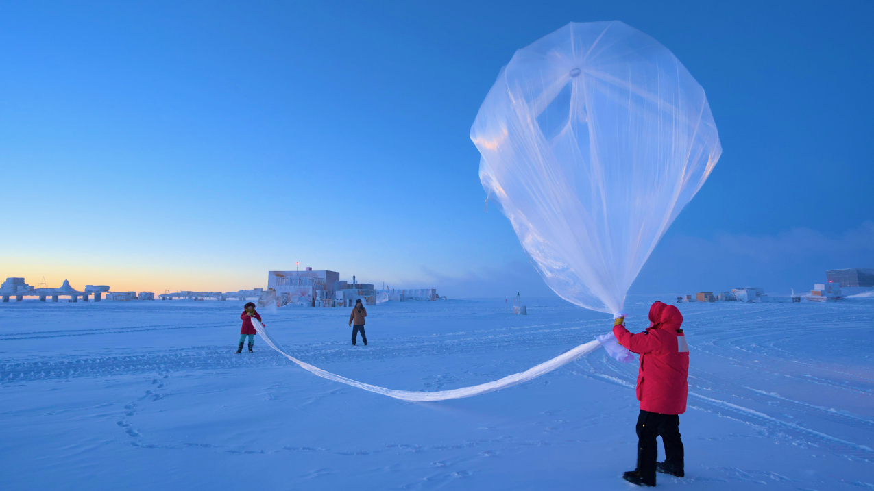 NOAA scientists launch a weather balloon carrying an ozonesonde at the South Pole on October 1, 2023.