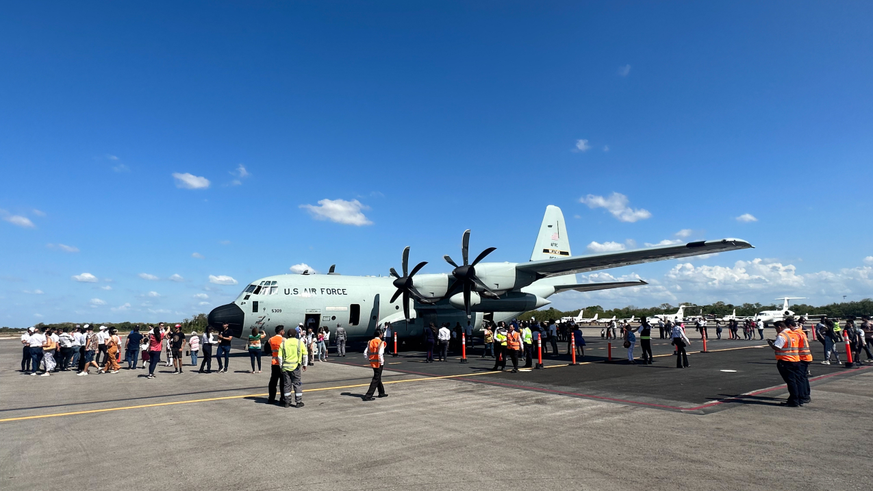 Photo showing People line up to board the U.S. Air Force Reserve Hurricane Hunter aircraft during the Caribbean Hurricane Awareness Tour 2023 in  Merida, Mexico on April 17, 2023.