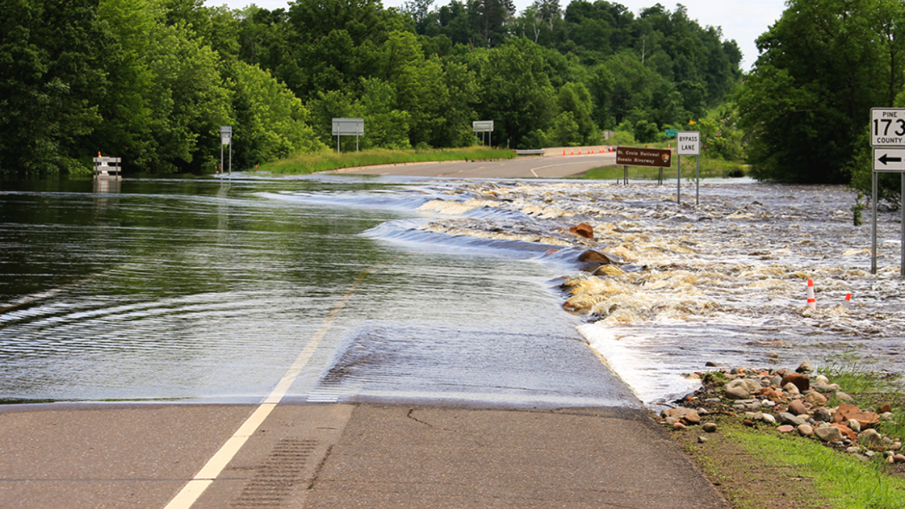 A cresting St. Croix river in Wisconsin overtakes a portion of highway. Parts of the Midwest saw flash flooding and record-high river crests in June. (Photo taken June 19, 2018, and posted online by staff from the Saint Croix National Scenic Riverway.)