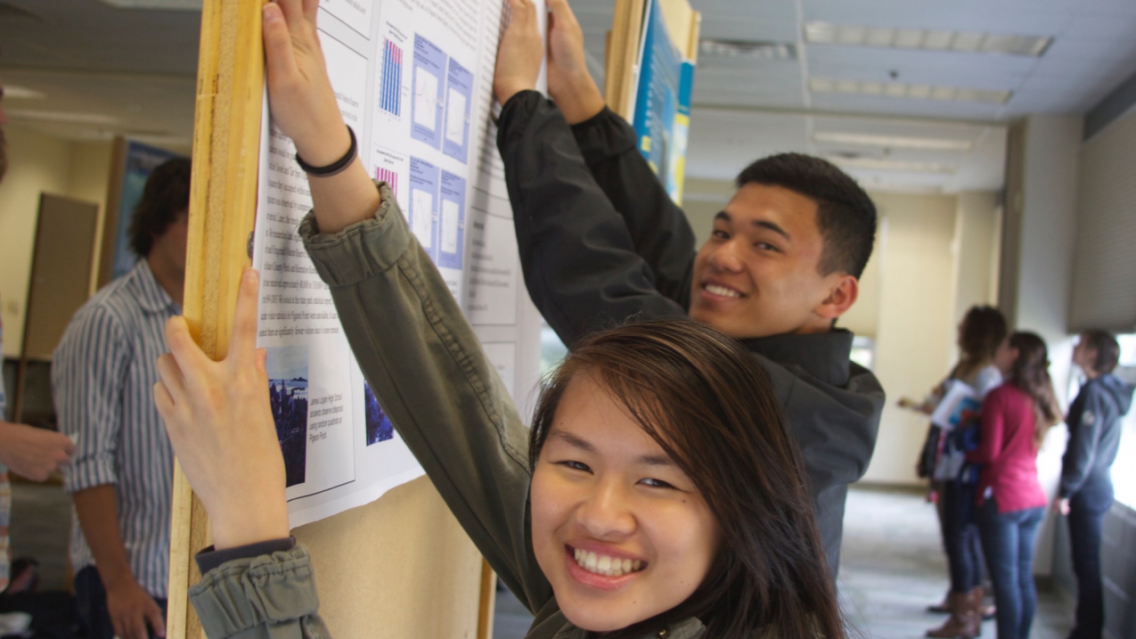 Students from James Logan High School put up their poster at the Monterey Bay Currents Symposium where they will present the scientific results of their LiMPETS Science Communication project.