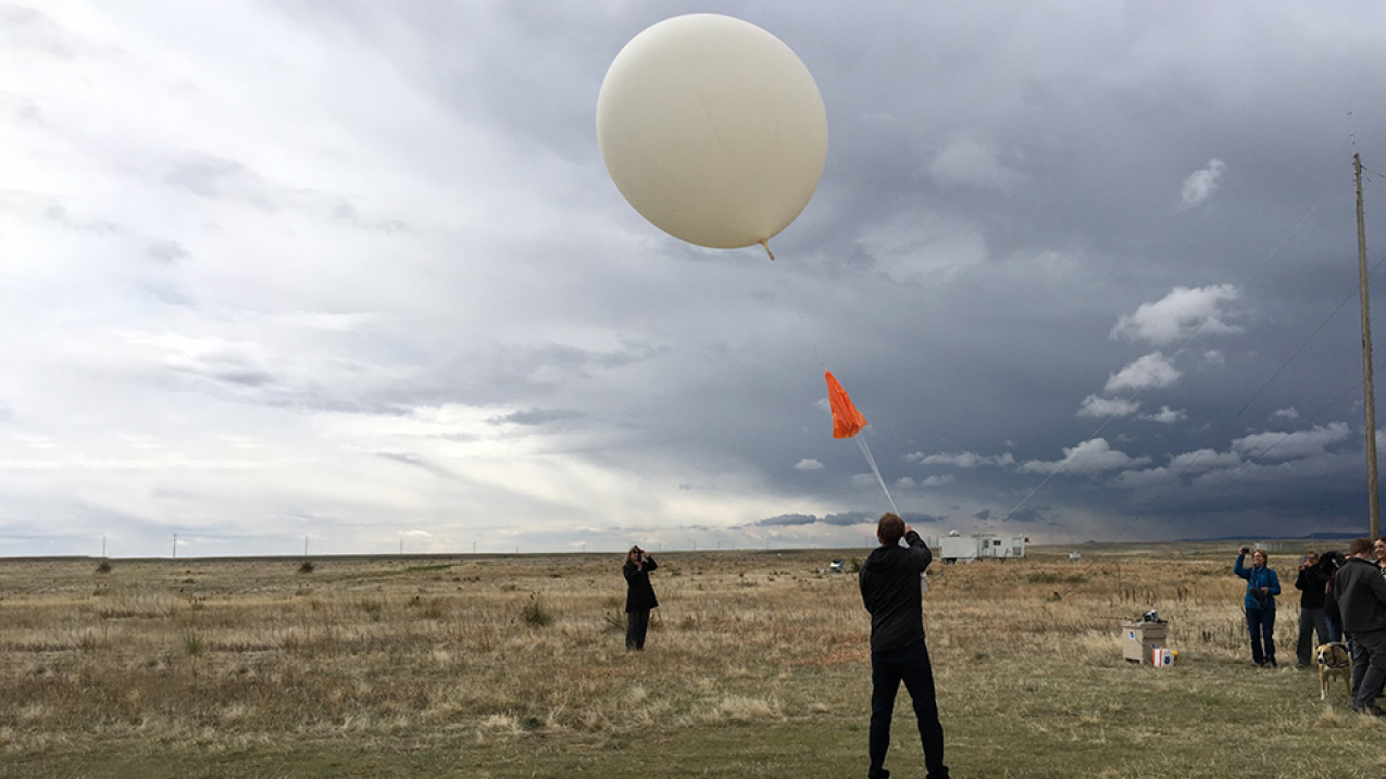 CIRES scientist Patrick Cullis releases a weather balloon carrying an ozonesonde from NOAA's Marshall Mesa on the 50th anniversary of the first ozonesonde launch from the research site near Boulder, Colorado, in 1967. 