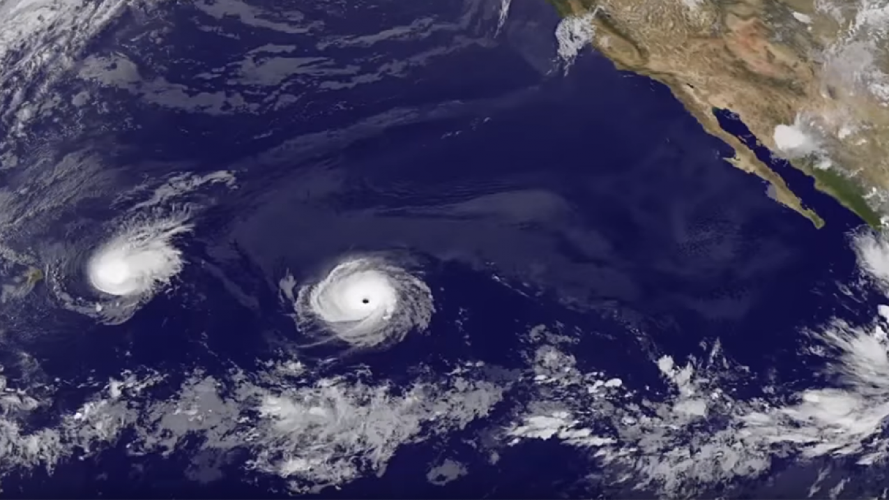 NOAA's GOES-West satellite captured Tropical Storm Madeline as it moved past Hawaii and Hurricane Lester approaching the Hawaiian Islands in August 2016. 