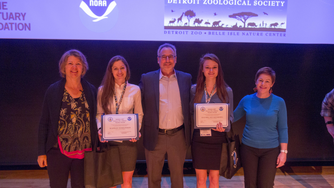Kaitlin Tomlinson and Rachel Stukenborg won the inaugural Science On a Sphere student contest for their datasets and lesson plans focusing on energy poverty. From left to right: Louisa Koch, Director of NOAA Education; Kaitlin Tomlinson, James Madison University; Ron Kagan, CEO and Executive Director of Detroit Zoo; Rachel Stukenborg, James Madison University; and Carrie McDougall, NOAA Education. 