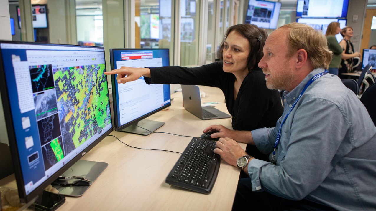 NOAA forecasters and researchers collaborate on a satellite data project at the National Weather Center in Norman, Oklahoma in 2018.