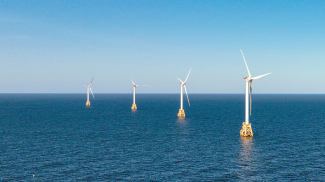 Photo of a wind turbines generate electricity at the Block Island Wind Farm on July 07, 2022 near Block Island, Rhode Island. 