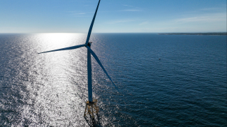 Photo of a wind turbines generate electricity at the Block Island Wind Farm on July 07, 2022 near Block Island, Rhode Island. 