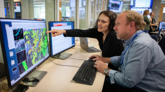 Forecasters at NOAA's National Severe Storm Laboratory in Norman, Oklahoma in 2018, working on the JPSS Convective Applications experiment of the Experimental Warning Program in the NOAA Hazardous Weather Testbed (HWT) at the National Weather Center. The GOES-R / JPSS experiment will have two components: a) an evaluation of multiple CONUS GOES-R convective applications, including satellite imagery, derived products, and multispectral applications along with GLM lightning; and b) a real-time evaluation of