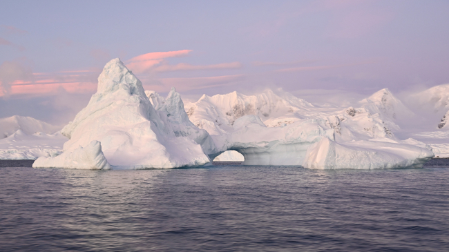 An arched iceberg along the Antarctic Peninsula, taken June 17, 2022.