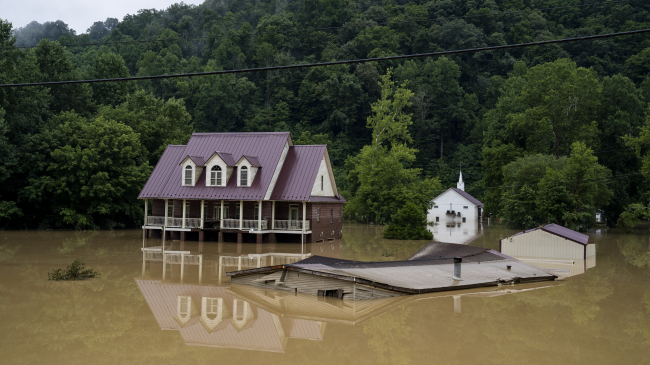  A house almost completely submerged by flood water off of the Bert T. Combs Mountain Parkway on July 29, 2022, in Breathitt County, Kentucky.
