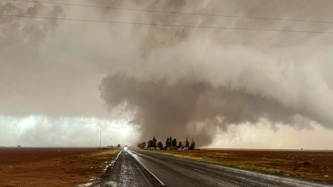 Photo of a tornado in Sudan, Texas on May 23, 2022 taken during the NOAA and partner Targeted Observations by Radar and UAS of Supercells (TORUS) field campaign. 