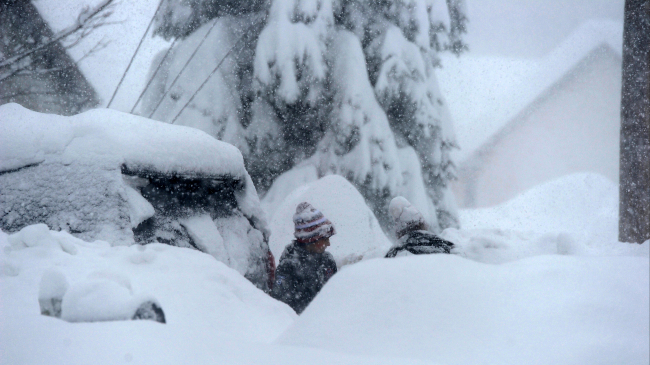 A person digs out after a record-breaking lake-effect snowstorm impacted the Hamburg, NY area on November 18, 2022. 