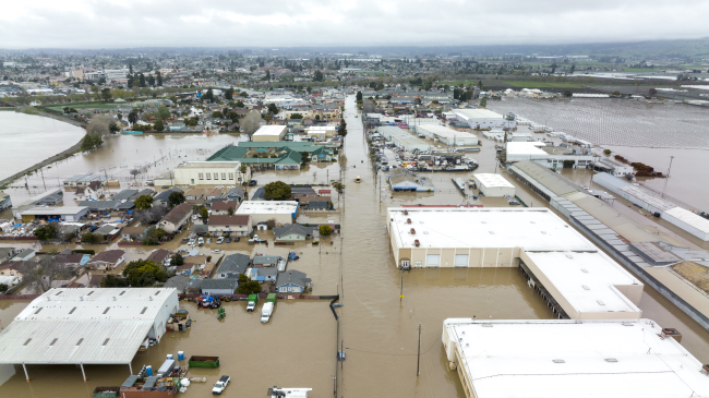 Photo of flooded town of Pajaro after heavy rain from an atmospheric river caused a levee to break. Monterey, California. March 12, 2023.