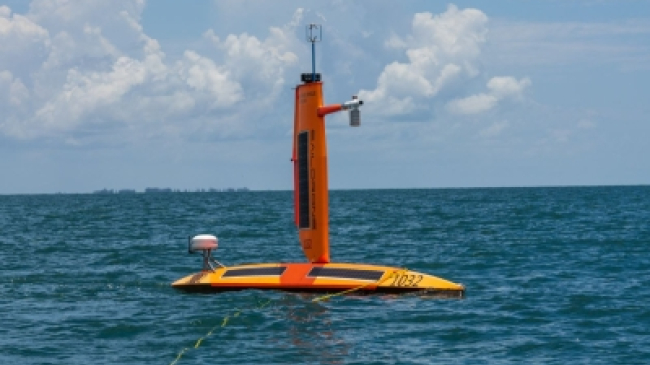 A Saildrone (uncrewed surface vehicle) in the Gulf of Mexico is prepared for deployment.