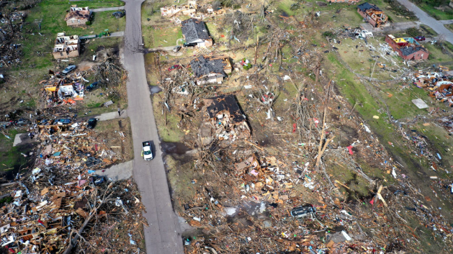 In an aerial view, piles of debris remain where homes once stood before an EF-4 tornado on March 26, 2023 in Rolling Fork, Mississippi. 