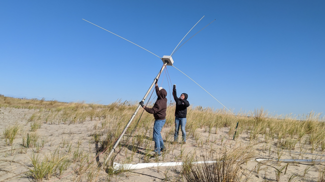 Image showing students from Rutgers University’s Masters in Operational Oceanography program installing a high-frequency radar antenna at Sandy Hook, NJ.  This radar is part of the national high-frequency radar network in the MARACOOS region.  There are more than 165 HFRs like this across the U.S., some of which are more than 24 years old.  A portion of the funds from these awards will be used to update, upgrade, and modernize these critical observing assets.
