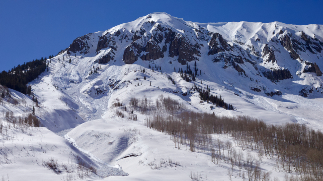 Several avalanche paths are visible on the slopes of Gothic Peak, which looms over one of the instrumented SPLASH research sites.