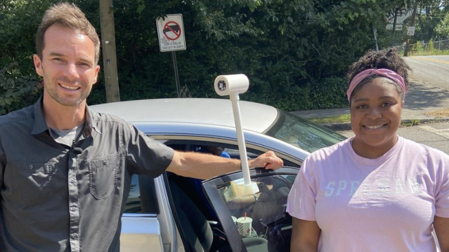 Photo showing Derek Van Dam, CNN meteorologist, and Brionna Findley, community volunteer, used a sensor attached to a car to measure temperature, humidity, time and location during NOAA’s 2021 urban heat island mapping campaign in Atlanta, Georgia. The data from volunteers was used to create a map to pinpoint the areas of the city most in need of cooling strategies. 