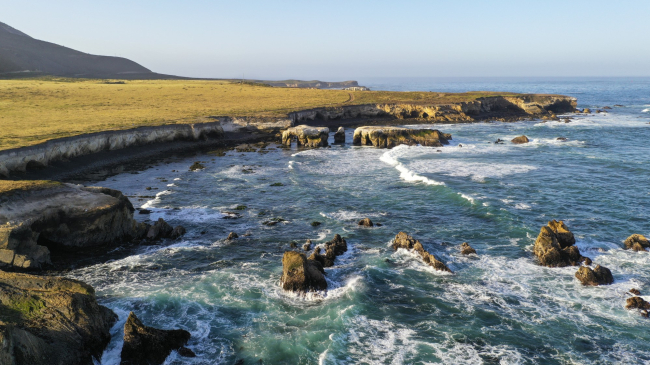Sunny view of the rocky coastline and deep blue water of the area proposed for the Chumash Heritage National Marine Sanctuary in San Luis Obispo County, California.