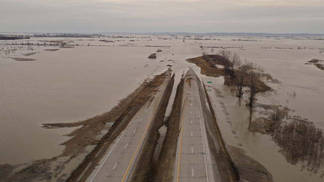 Image showing floodwater covers Highway 2 on March 23, 2019 near Sidney, Iowa. Midwest states are battling some of the worst flooding they have experienced in decades as rain and snow melt from the recent "bomb cyclone" has inundated rivers and streams. At least three deaths have been linked to the flooding.
