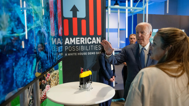 President Joe Biden and Allison Fundis, COO of Ocean Exploration Trust, discuss an exhibit at American Possibilities: A White House Demo Day, on November 9, 2023.