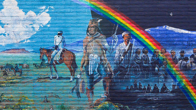 Gallup, New Mexico: Artist Richard K. Yazzie shows the history of his Navajo people after they were released from Fort Sumner in the 1860s. The mural is painted in the four sacred colors of black, blue, yellow, and white, according to GallupMainStreet.org.
