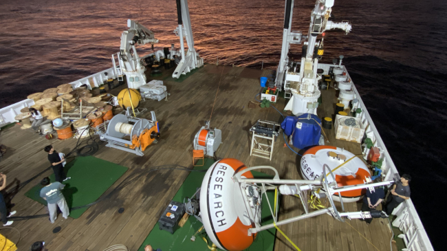 RAMA moorings await deployment in the Indian Ocean on the back deck of the research vessel Isabu at sunset.