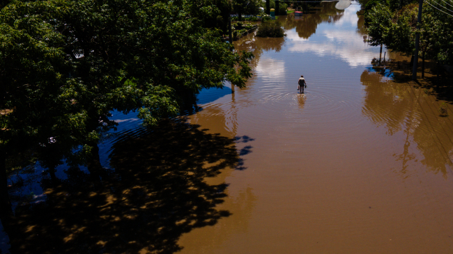 January 9, 2024: A resident walks through floodwater in Rochester, Australia, after heavy rainfall. January 2024 was the second-wettest January for the globe, following on the heels of a record-wet December.