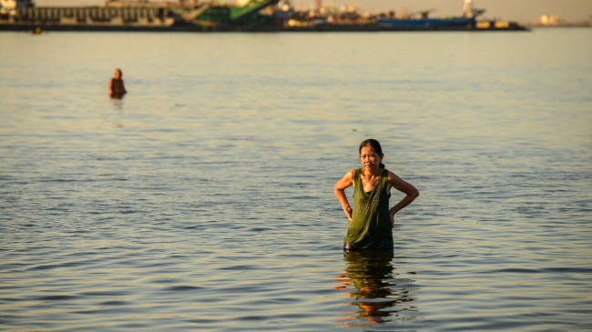 MARCH 30, 2024, PHILIPPINES: A person takes a dip in Manila Bay, hoping to cool down as the state weather bureau warned of heat indexes reaching dangerous levels of up to 110 degrees F in some areas. March 2024 was the warmest March on record for the world, and the tenth month in a row of record heat.