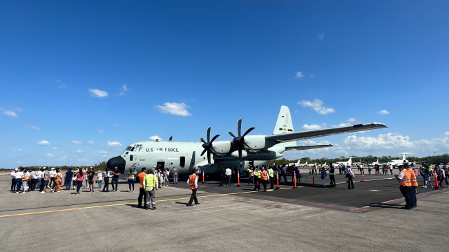 Photo showing People line up to board the U.S. Air Force Reserve Hurricane Hunter aircraft during the Caribbean Hurricane Awareness Tour 2023 in  Merida, Mexico on April 17, 2023.