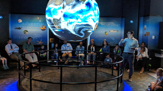 Meteorologist/Climatologist Tom DiLiberto presents on NOAA Science On a Sphere during NOAA Kids Day 2019.
