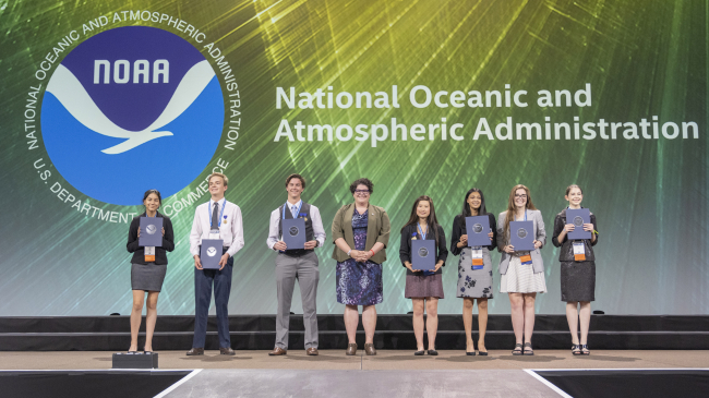 On May 16, 2019, NOAA Education Outreach Specialist, Bekkah Lampe (center), presented the Taking the Pulse of the Planet awards to seven students at the Intel International Science and Engineering Fair in Phoenix, Arizona. 