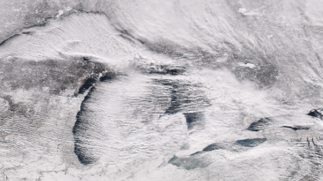 Lake effect snow bands moving across the Great Lakes, seen from the Suomi NPP polar-orbiting satellite on December 25, 2017.