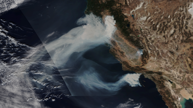 Smoke from two large fires, the Camp Fire in northern California and the Woolsey Fire in southern California.