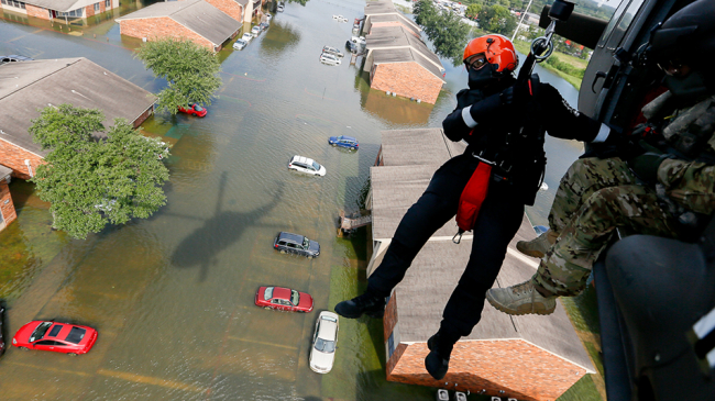 Members of the South Carolina's Helicopter Aquatic Rescue Team (SC-HART) perform rescue operations in Port Arthur, Texas, on August 31, 2017, after Hurricane Harvey.