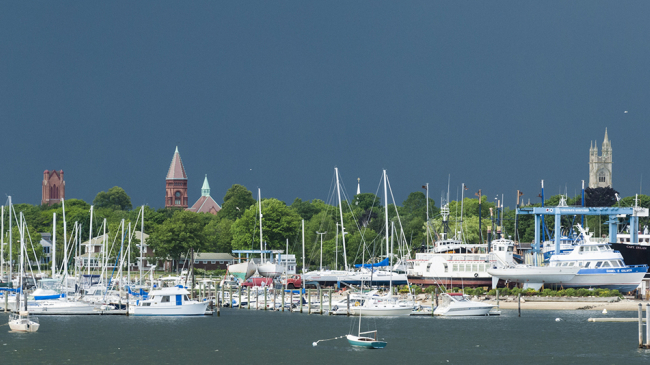Summer storm darkening the sky over the Acushnet River in Massachusetts.
