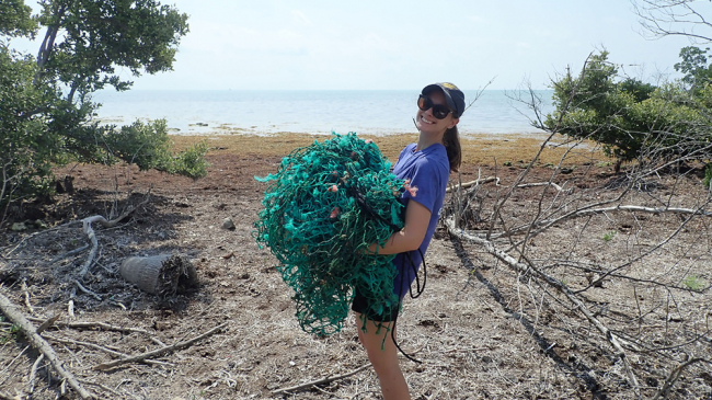 University of Florida student holds rope found on the Sugarloaf Key shoreline. Rope can entangle marine life and is especially important to remove. 