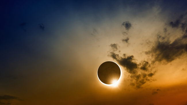 A full sun eclipse with clouds.