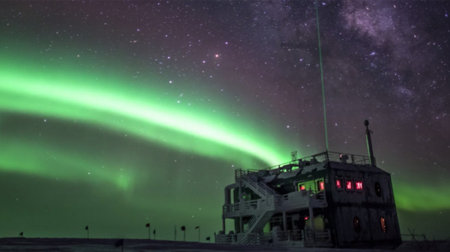 An aurora and the Milky Way over South Pole Station in Antarctica on June 23, 2009. 