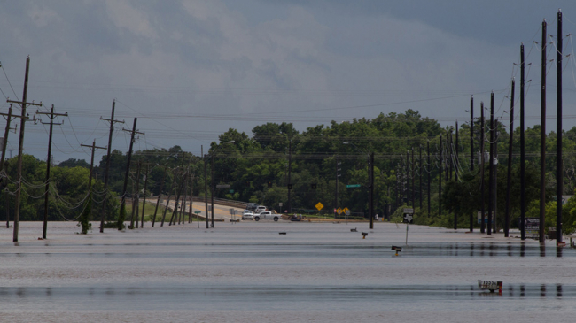 Flooded roadway as seen from a Texas National Guard Light Medium Tactical Vehicle (LMTV). Texas Guardsmen evacuate Texans in need from severe flooding in Fort Bend County, Texas, June 2, 2016. 